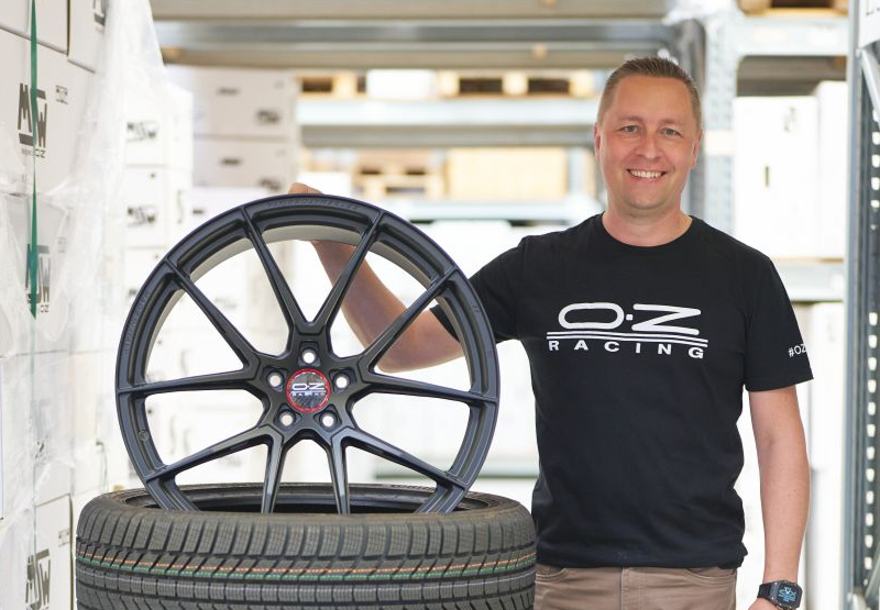 Man inspecting a tire